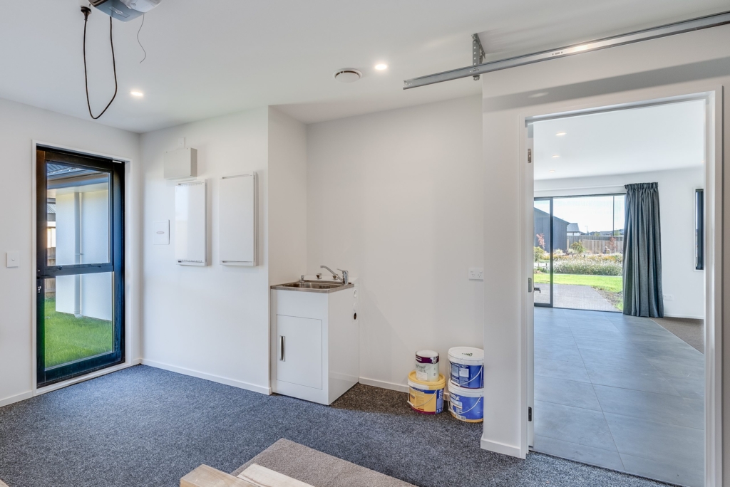 Garage of 5-bedroom 4-bathroom custom home at Nancy Wake Street, Rolleston
