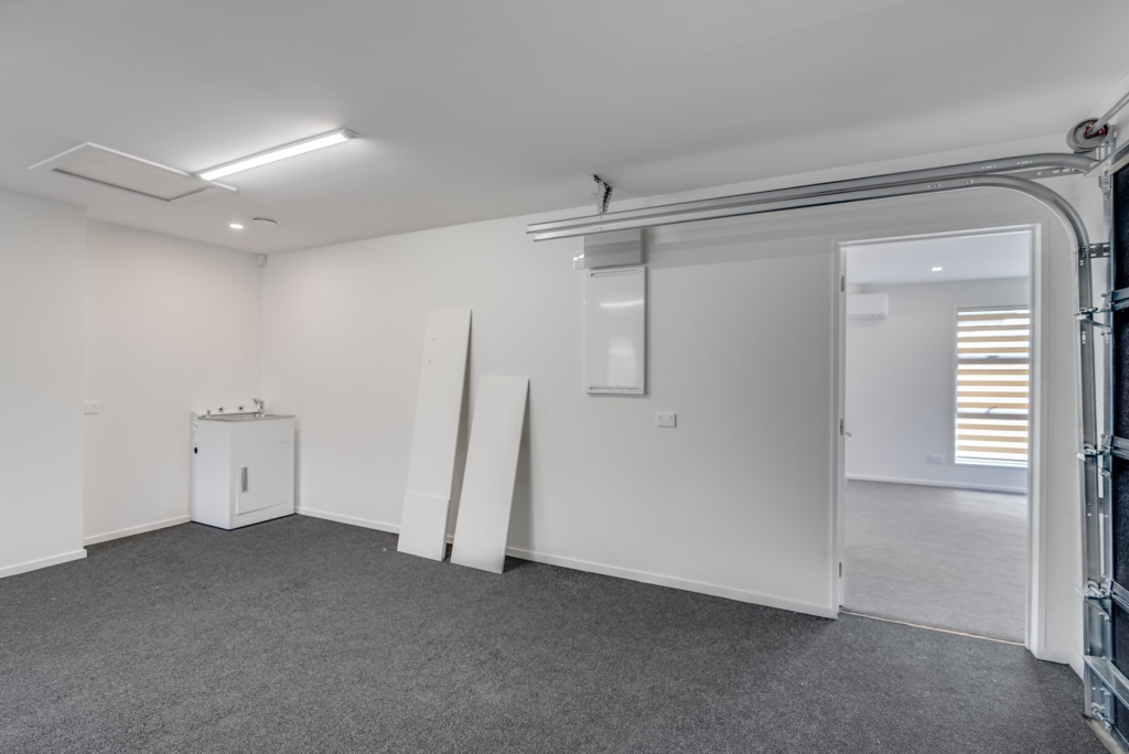 Garage of 3-bedroom 3-bathroom custom home at Nancy Wake Street, Rolleston