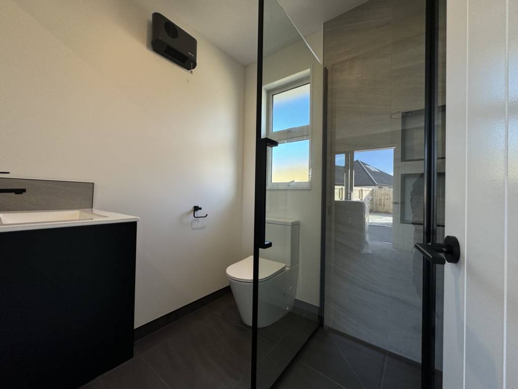 Bathroom in 3-bedroom 3-bathroom custom home at Acland Park, Rolleston