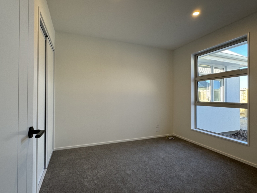 Bedroom in 3-bedroom 3-bathroom custom home at Acland Park, Rolleston