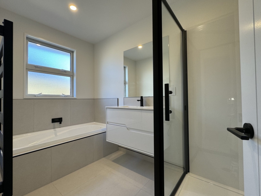 Bathroom in 3-bedroom 3-bathroom custom home at Acland Park, Rolleston