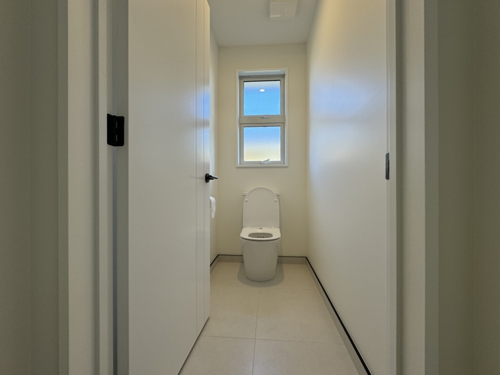 Bathroom in 3-bedroom 3-bathroom custom home at Acland Park, Rolleston