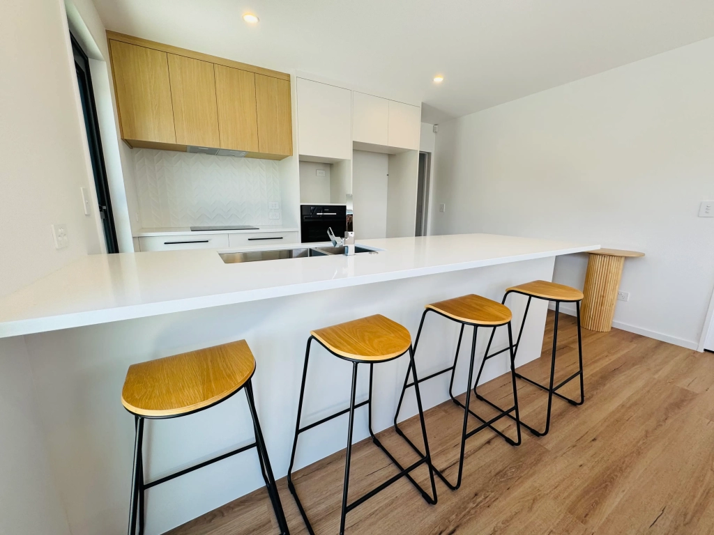 Kitchen in 3-bedroom 6-unit townhouse development at Bernina Lane, Wigram