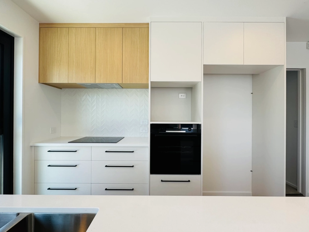 Kitchen in 3-bedroom 6-unit townhouse development at Bernina Lane, Wigram