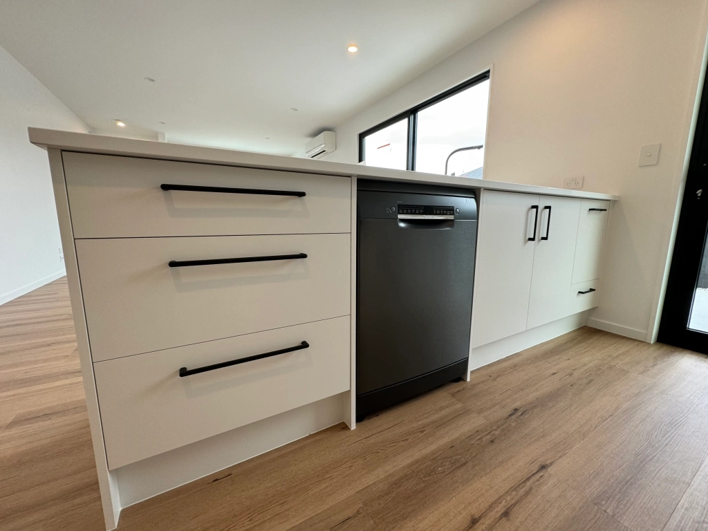 Kitchen in 3-bedroom 6-unit townhouse development at Bernina Lane, Wigram