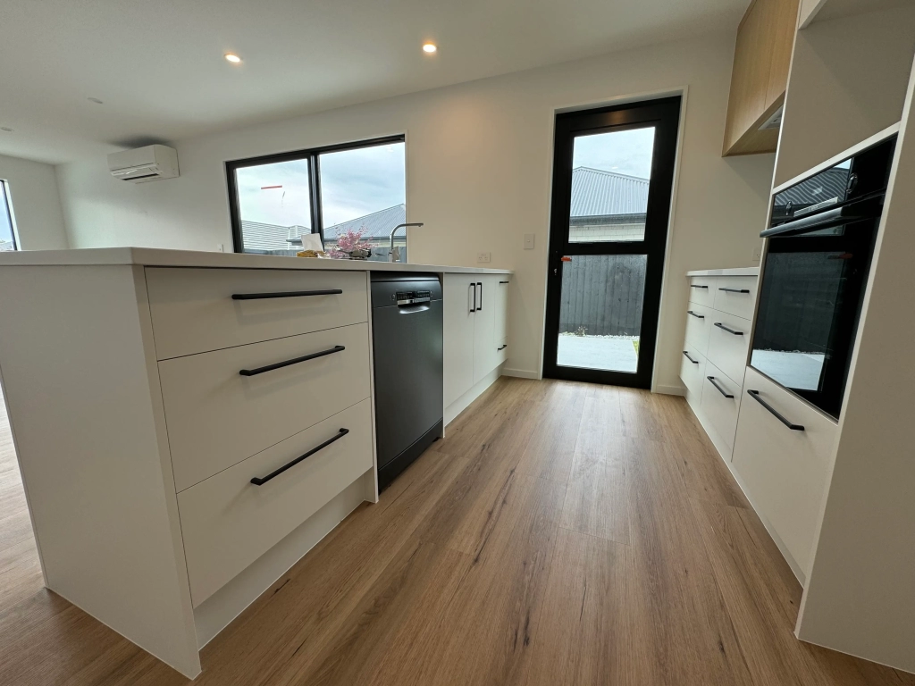 Kitchen in 3-bedroom 6-unit townhouse development at Bernina Lane, Wigram