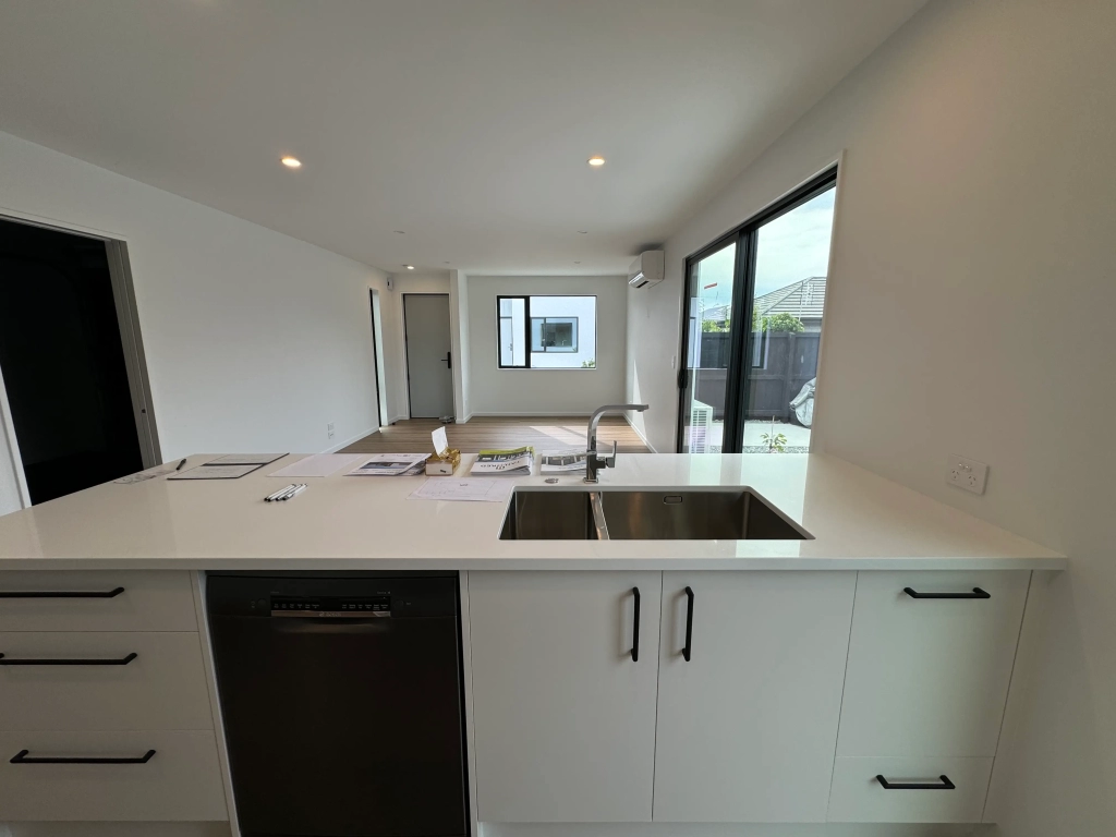 Kitchen in 3-bedroom 6-unit townhouse development at Bernina Lane, Wigram