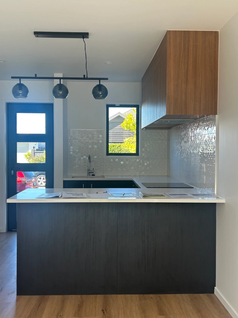 Kitchen in 2-bedroom 15-unit townhouse development at Deal Street, Wigram