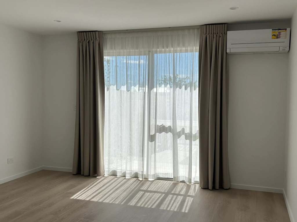 Living area in 2-bedroom 26-unit townhouse development at Boardway Parade, Rolleston