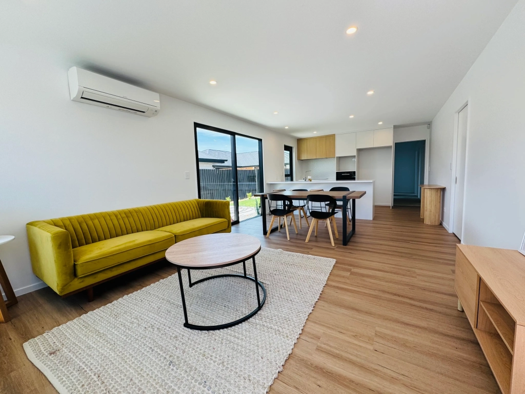 Living area in 3-bedroom 6-unit townhouse development at Bernina Lane, Wigram