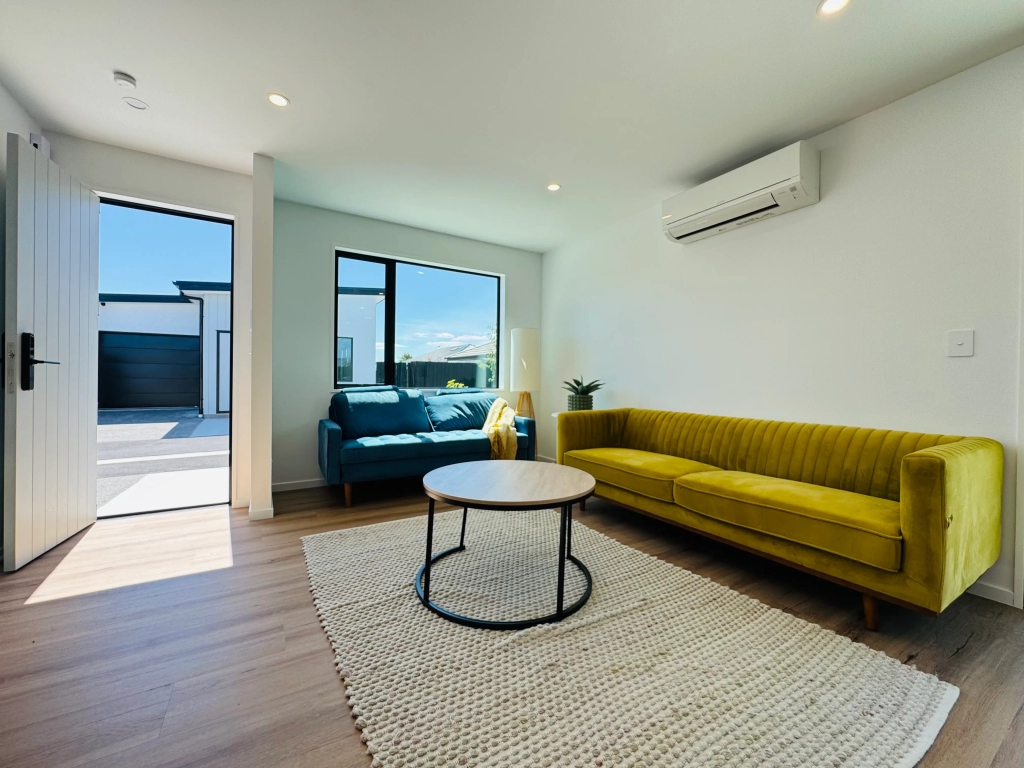 Living area in 3-bedroom 6-unit townhouse development at Bernina Lane, Wigram