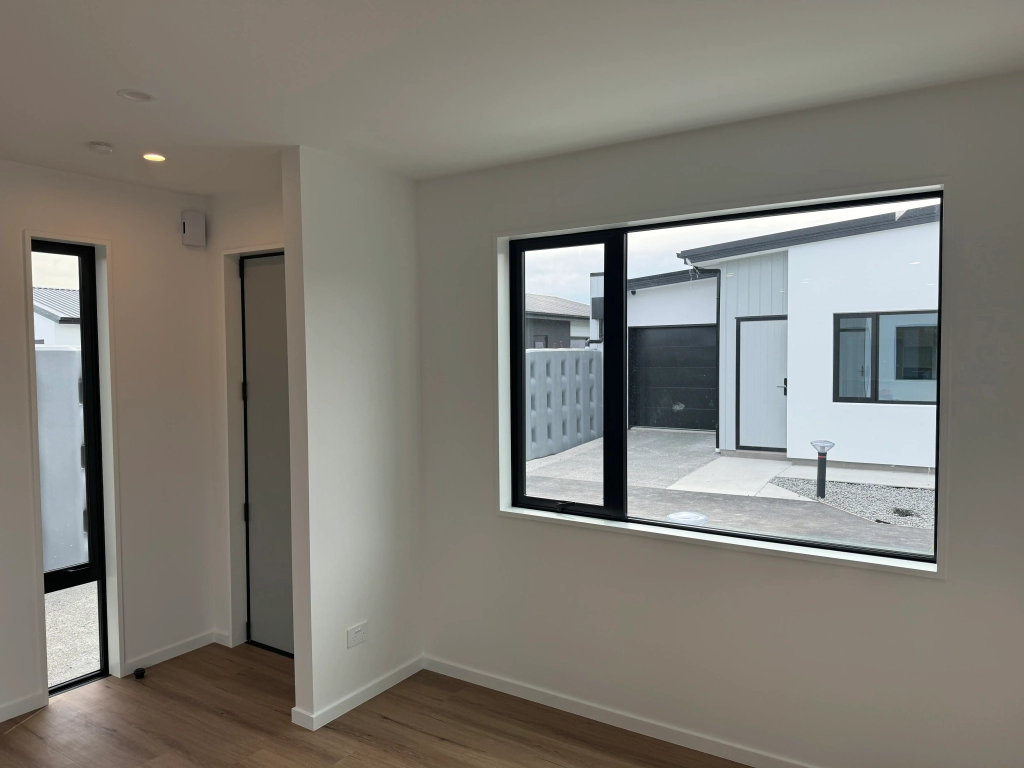 Living area in 3-bedroom 6-unit townhouse development at Bernina Lane, Wigram