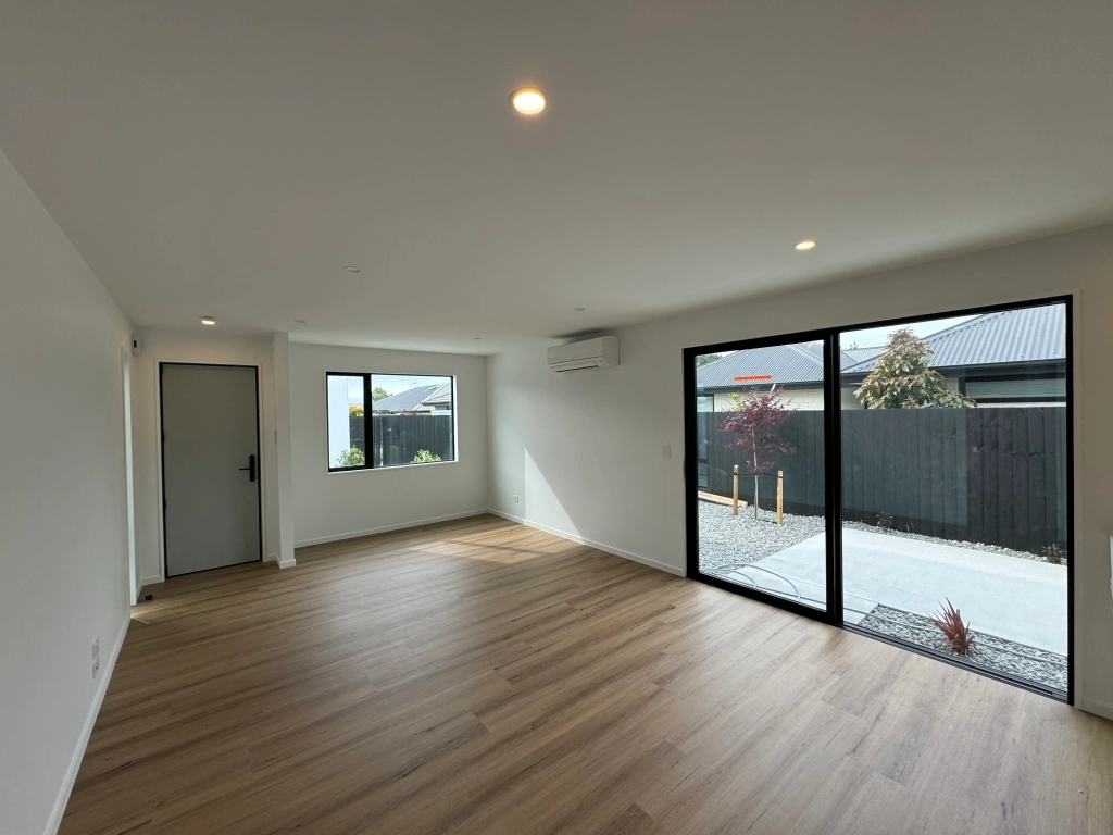 Living area in 3-bedroom 6-unit townhouse development at Bernina Lane, Wigram
